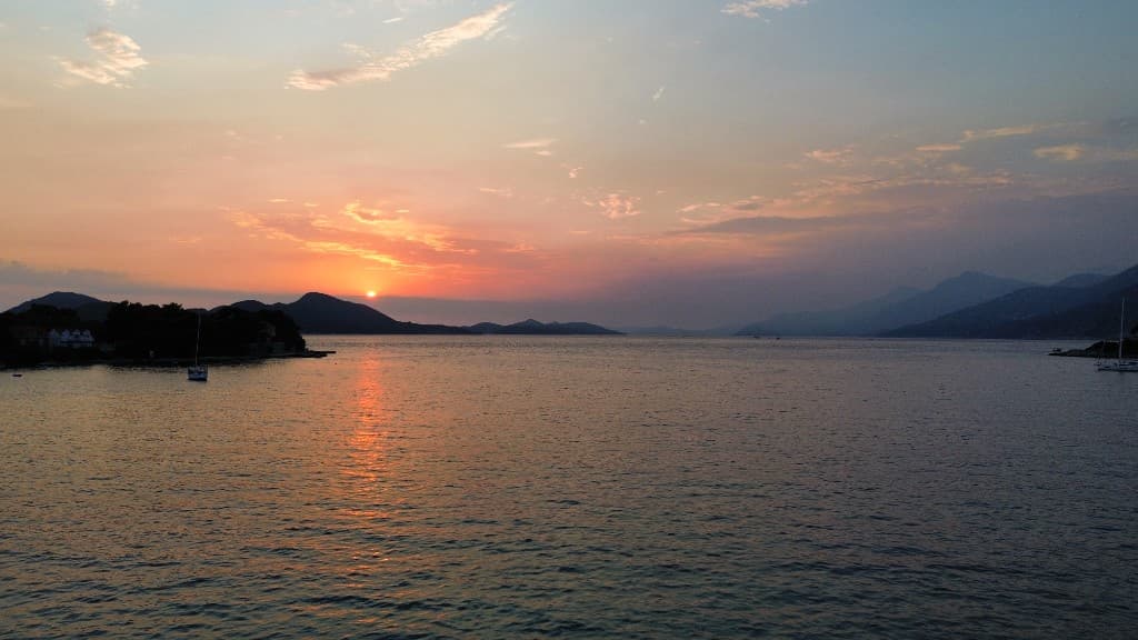 Panoramic sunset over the Adriatic Sea from a boat tour